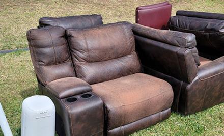 junk removal furniture recliner couch on grass curbside for pickup