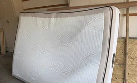 old mattress for pickup in garage