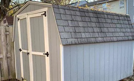 shed before demo & removal in PBG backyard by fence